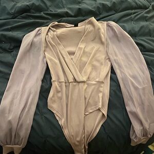 Lilac colored onesie.